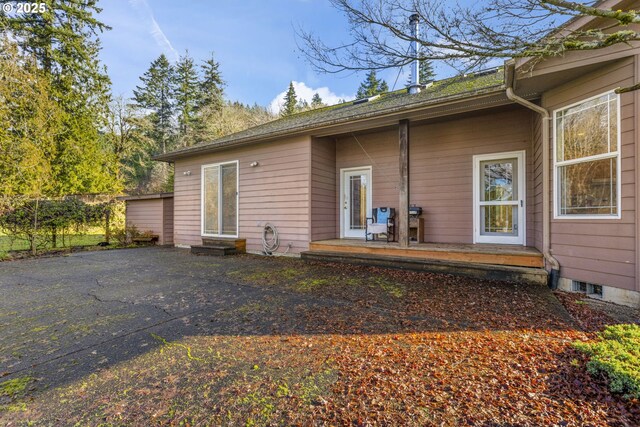 back of property featuring a patio area