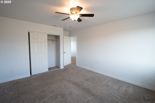 unfurnished bedroom with a closet, baseboards, visible vents, and carpet floors