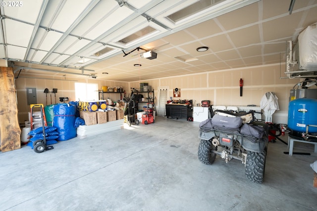 garage featuring a garage door opener and electric panel