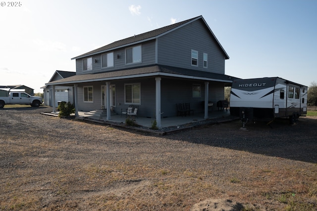 farmhouse inspired home featuring covered porch