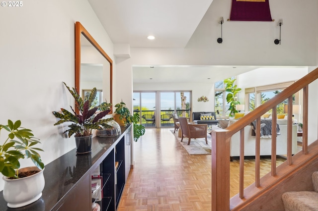 foyer with recessed lighting and stairs