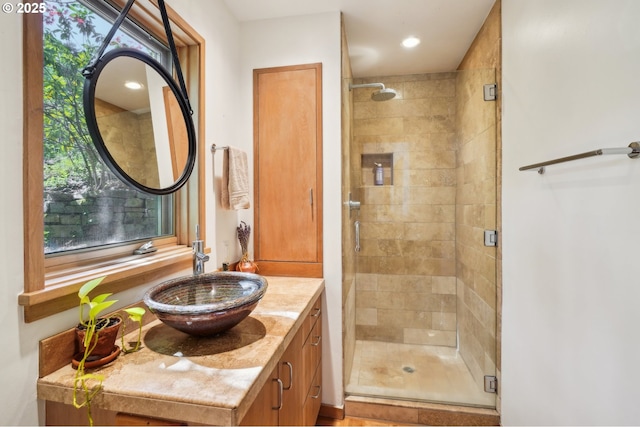 bathroom with vanity and a stall shower
