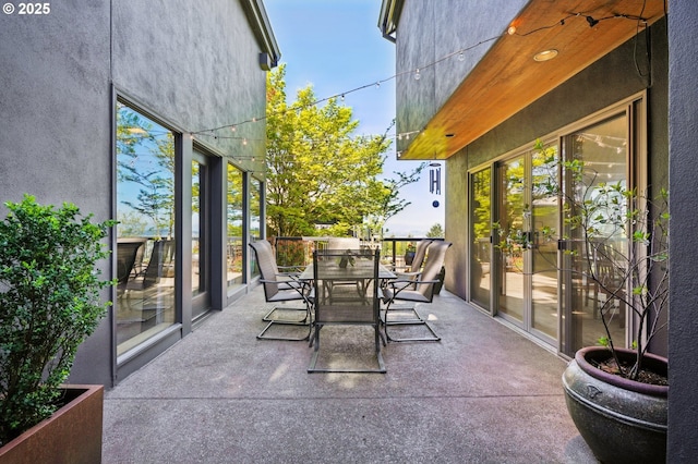 view of patio featuring outdoor dining area
