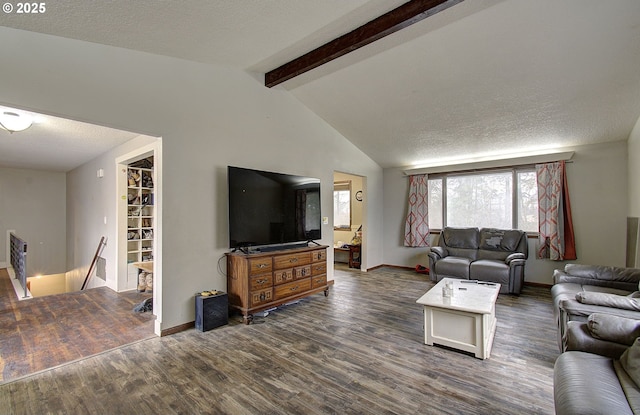 living area with baseboards, dark wood finished floors, lofted ceiling with beams, and a textured ceiling