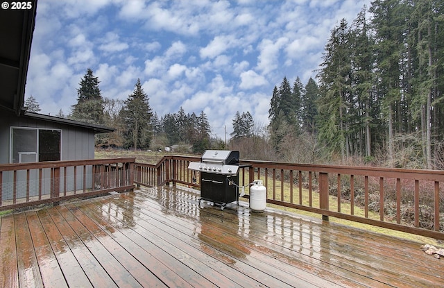 wooden terrace with a grill