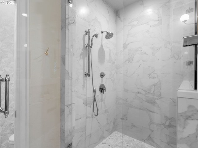 full bath with a marble finish shower