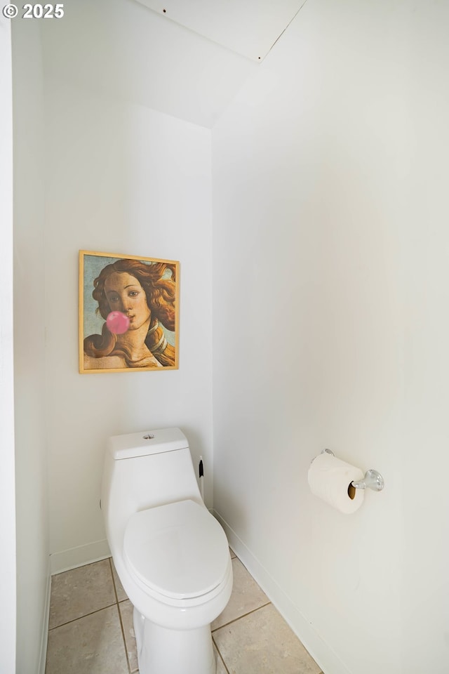 bathroom featuring tile patterned flooring and toilet