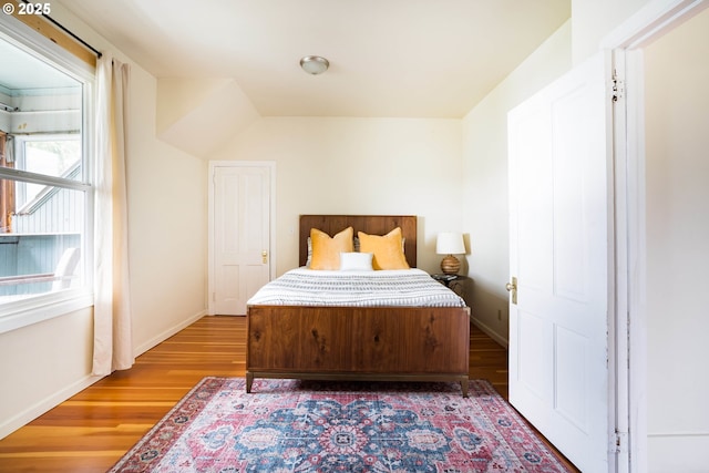 bedroom with hardwood / wood-style flooring