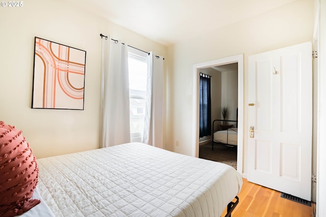 bedroom featuring hardwood / wood-style flooring