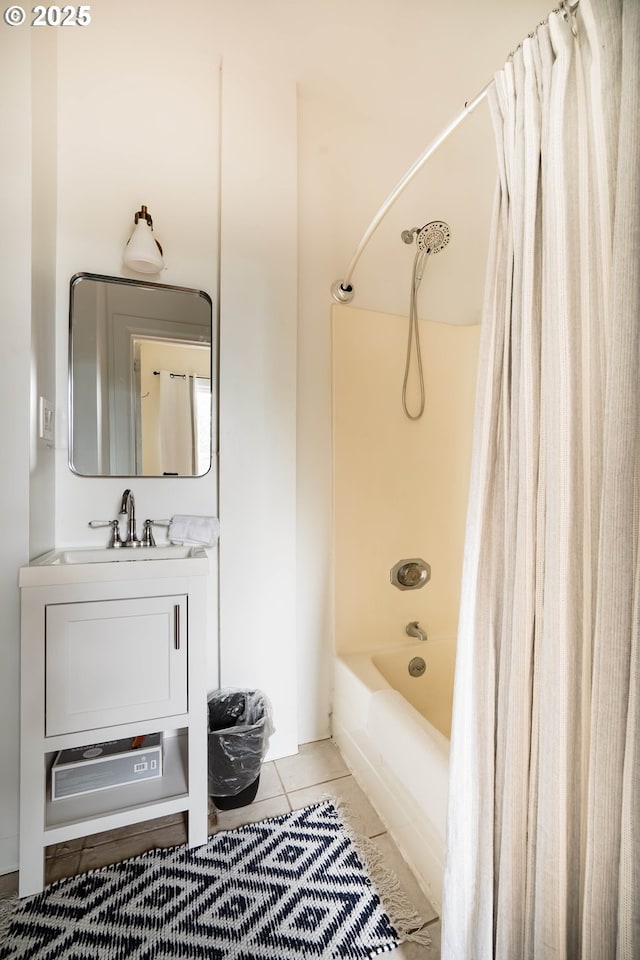 bathroom featuring tile patterned flooring, vanity, and shower / bath combination with curtain