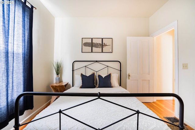 bedroom featuring hardwood / wood-style floors