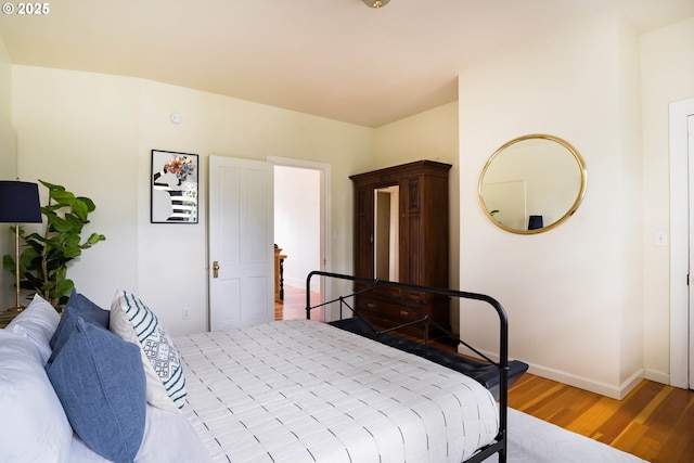 bedroom featuring hardwood / wood-style flooring