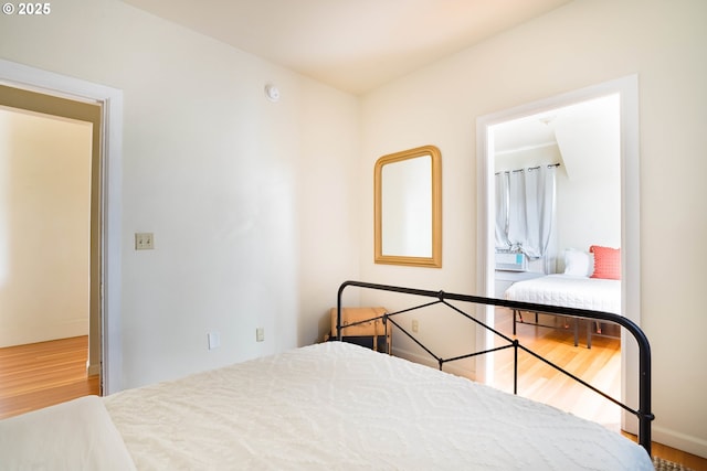 bedroom with wood-type flooring