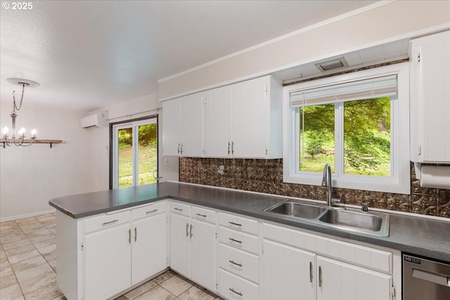 5713 Lewis River Rd, Ariel, WA 98603 - kitchen featuring a sink, dishwasher, a peninsula, and dark countertops