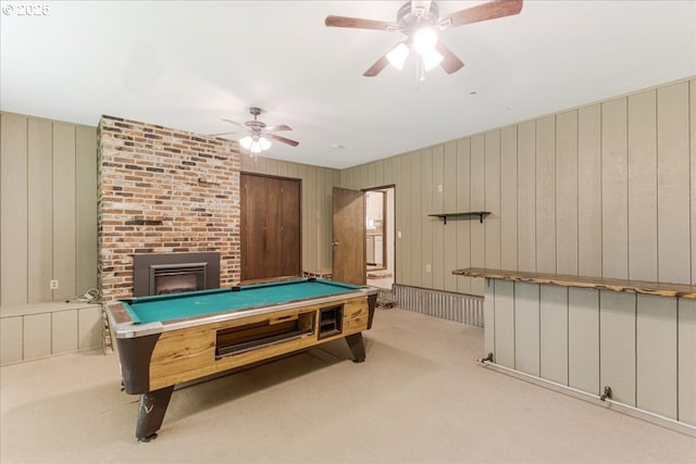 5713 Lewis River Rd, Ariel, WA 98603 - recreation room featuring carpet, pool table, a ceiling fan, a brick fireplace, and wood walls