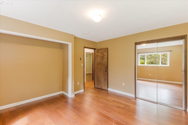 5713 Lewis River Rd, Ariel, WA 98603 - unfurnished bedroom featuring a closet, light wood finished floors, and baseboards