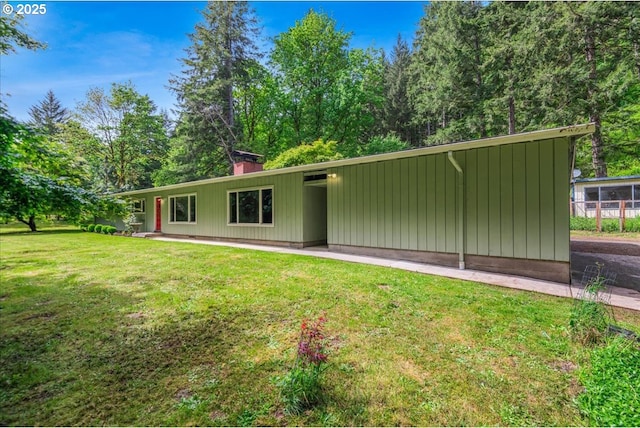 5713 Lewis River Rd, Ariel, WA 98603 - view of front of property with a front yard and a chimney