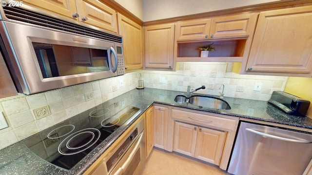 kitchen featuring a sink, open shelves, dark stone countertops, backsplash, and appliances with stainless steel finishes