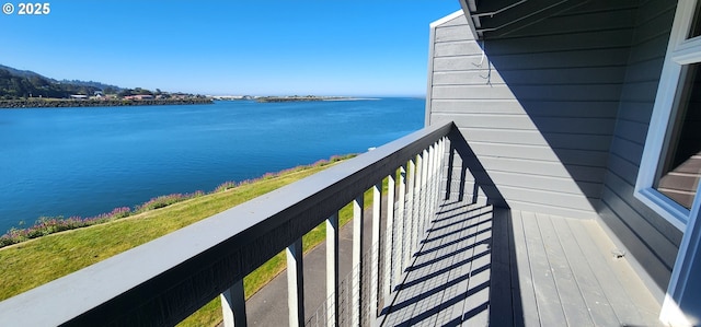 balcony featuring a water view
