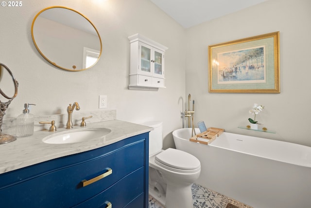 bathroom featuring a soaking tub, toilet, and vanity