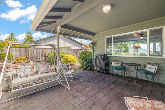 view of patio / terrace featuring area for grilling and fence