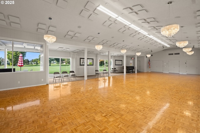 interior space with baseboards and a chandelier