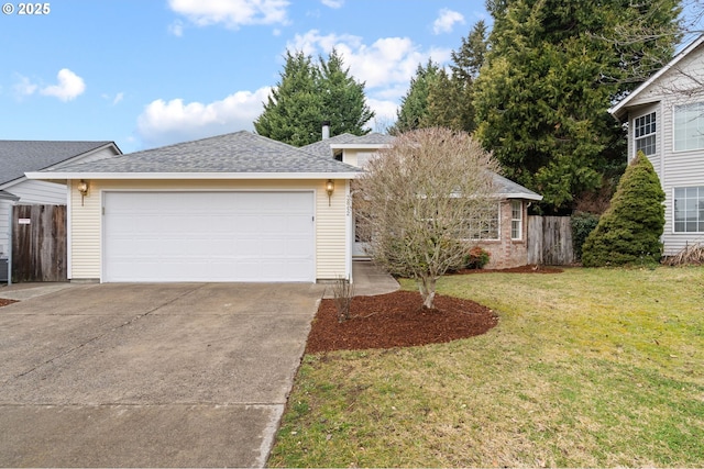 view of front of house featuring a garage and a front lawn