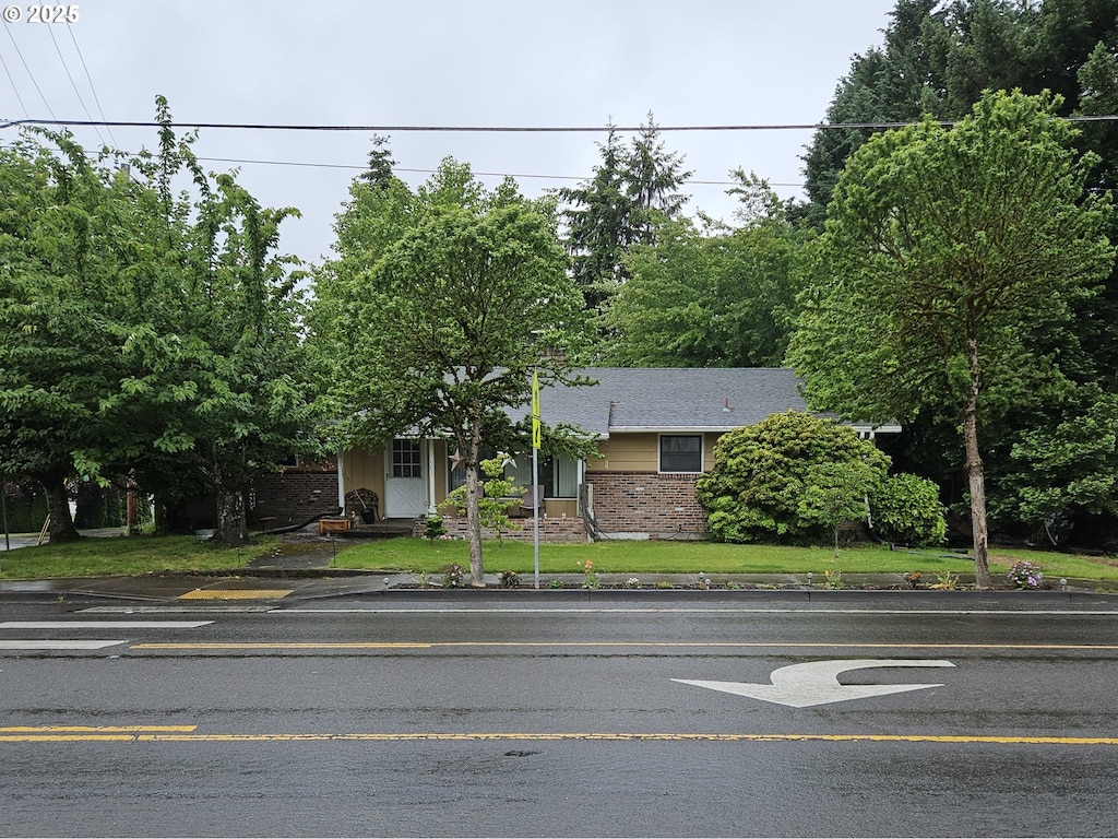 902 N Parkway Ave, Battle Ground, WA 98604 - view of property hidden behind natural elements with brick siding
