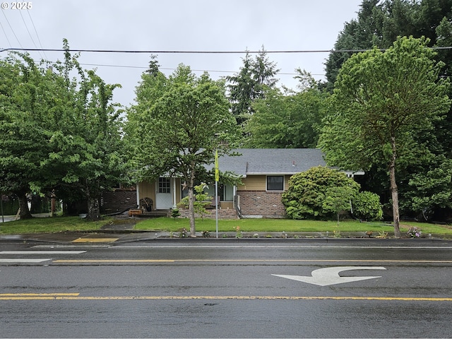 902 N Parkway Ave, Battle Ground, WA 98604 - view of property hidden behind natural elements with brick siding