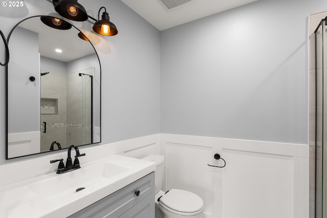 10800 SE 17th Cir Unit T-218, Vancouver, WA 98664 - full bathroom featuring wainscoting, a stall shower, toilet, and vanity
