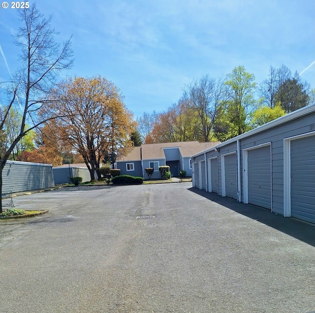 view of street featuring community garages