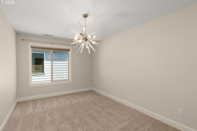 unfurnished room with baseboards, carpet flooring, an inviting chandelier, and visible vents