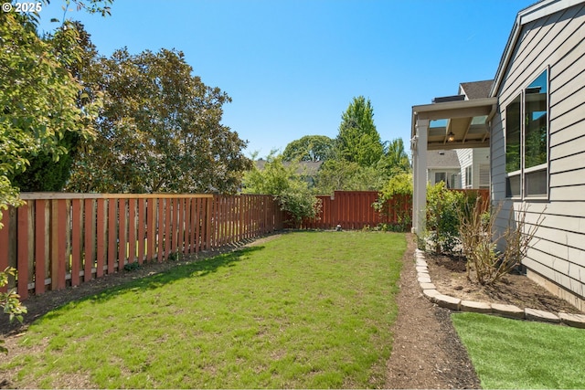 view of yard with a fenced backyard