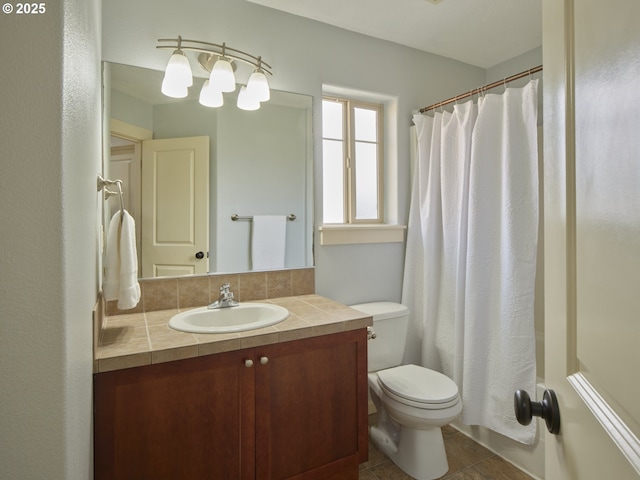 bathroom featuring walk in shower, tile patterned floors, vanity, and toilet