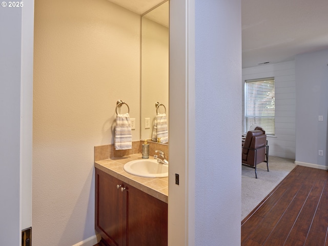 bathroom featuring wood-type flooring and vanity