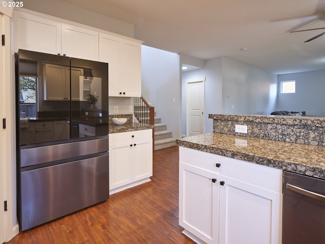 kitchen featuring white cabinets, dark wood-type flooring, ceiling fan, and dark stone counters