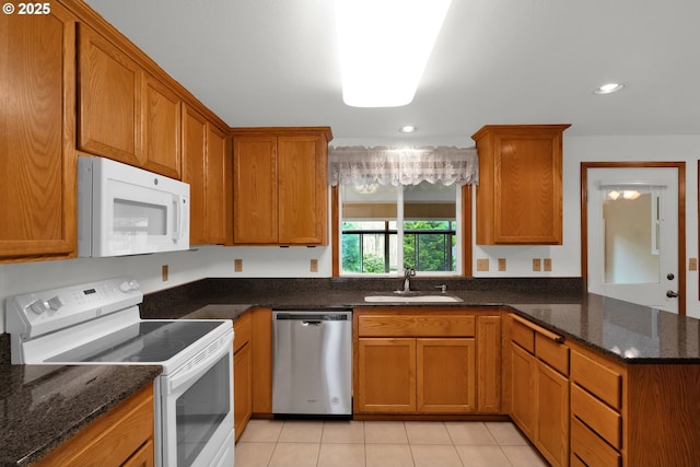 3909 Spruce St, Florence, OR 97439 - kitchen with white appliances, a sink, brown cabinetry, and recessed lighting