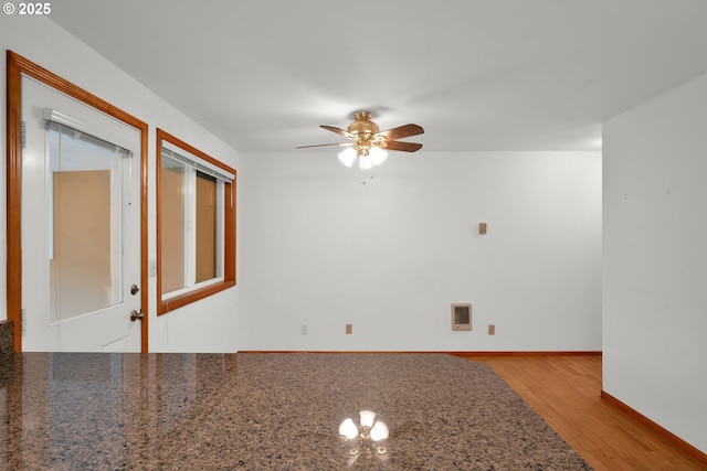 3909 Spruce St, Florence, OR 97439 - spare room featuring ceiling fan, wood finished floors, and baseboards