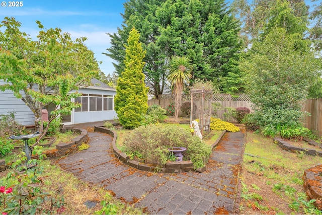 3909 Spruce St, Florence, OR 97439 - fenced backyard featuring a sunroom