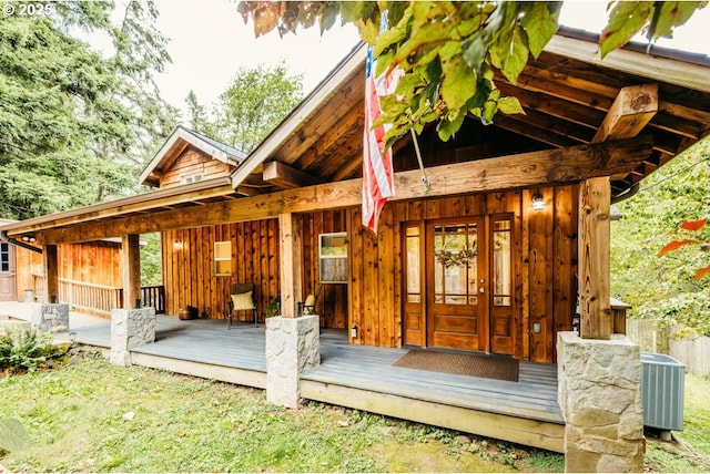 property entrance featuring central AC and covered porch