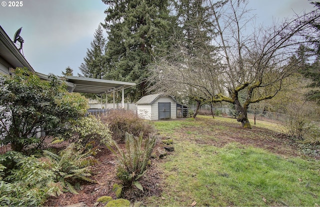 view of yard with an outbuilding, a storage shed, and a fenced backyard