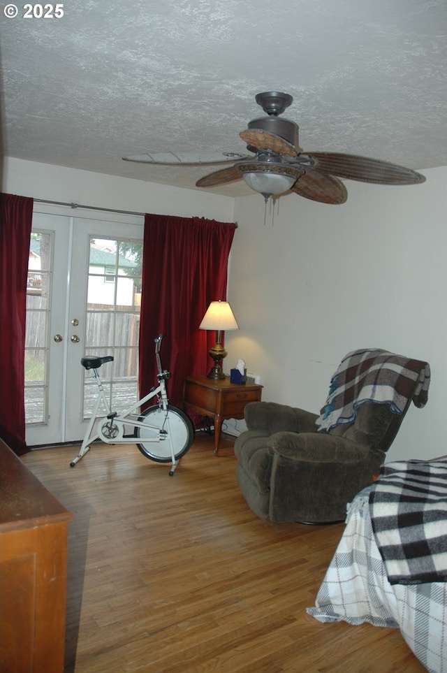 124 S 20th St, Saint Helens, OR 97051 - living area featuring wood finished floors, a textured ceiling, and ceiling fan