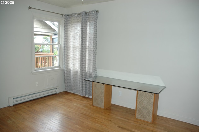 124 S 20th St, Saint Helens, OR 97051 - spare room featuring a baseboard radiator and light wood-style flooring