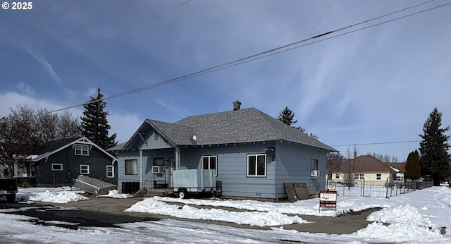 view of front of home with a shingled roof