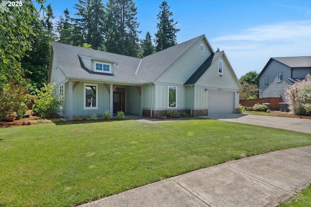 2832 NE Cole Ave, Mcminnville, OR 97128 - view of front of house featuring board and batten siding, concrete driveway, stone siding, roof with shingles, and a porch