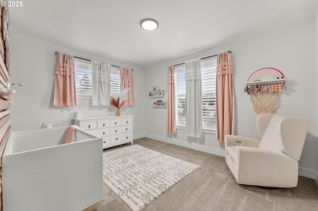 carpeted bedroom with a crib