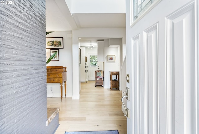 entrance foyer with light wood-style floors