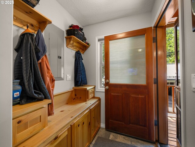 25210 E Arrah Wanna Blvd, Welches, OR 97067 - mudroom with a textured ceiling and electric panel