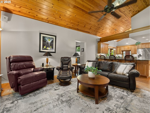 25210 E Arrah Wanna Blvd, Welches, OR 97067 - living area with vaulted ceiling, wooden ceiling, a ceiling fan, light wood-style floors, and baseboards