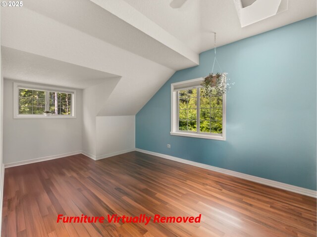 25210 E Arrah Wanna Blvd, Welches, OR 97067 - bonus room with wood finished floors, baseboards, and lofted ceiling